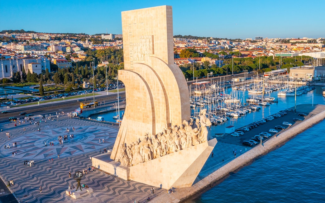 Monument to the Discoveries in Lisbon with Jerónimos Monastery in the background.