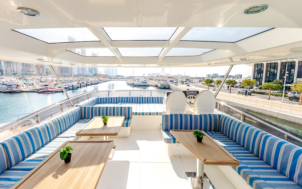 Dubai marina view from luxury yacht deck during sunset tour.