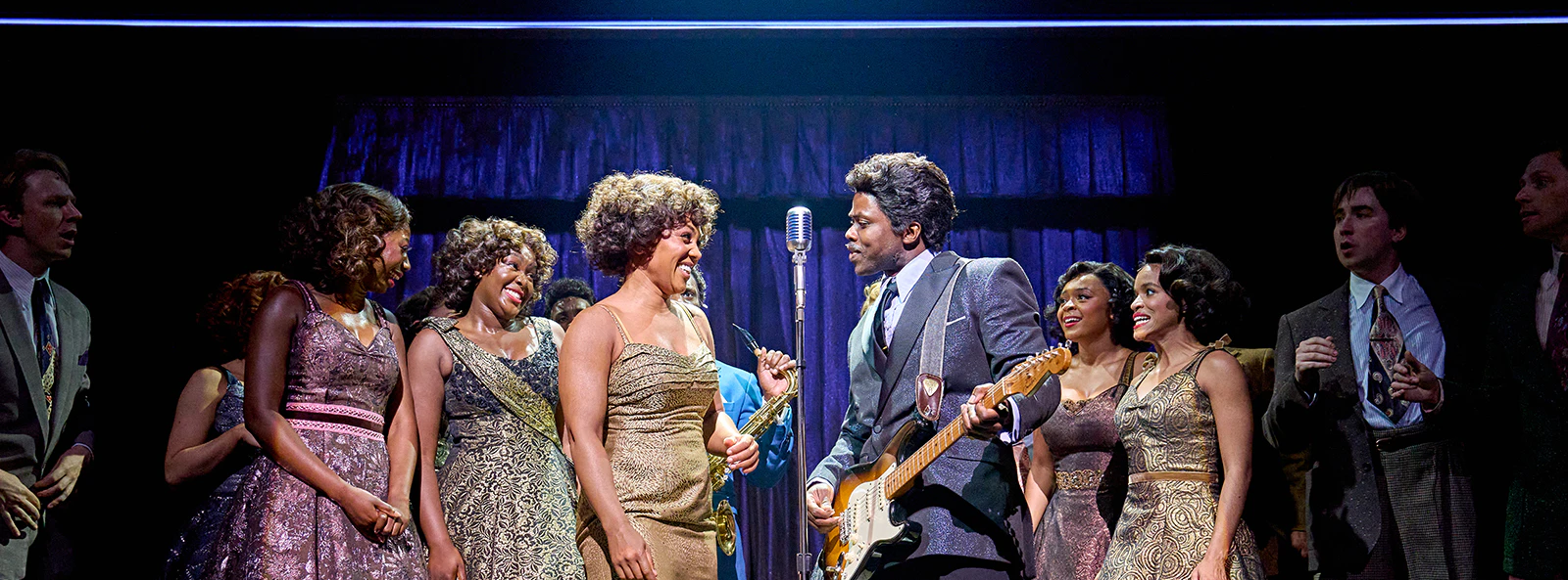 Cast performing on stage in TINA: The Tina Turner Musical.