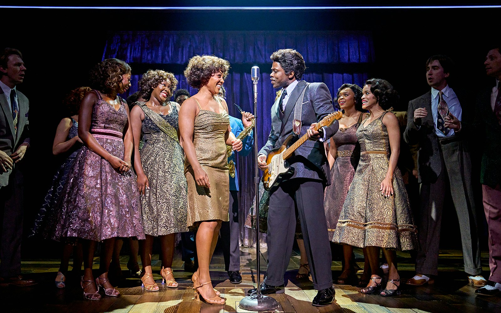 Cast performing on stage in TINA: The Tina Turner Musical.