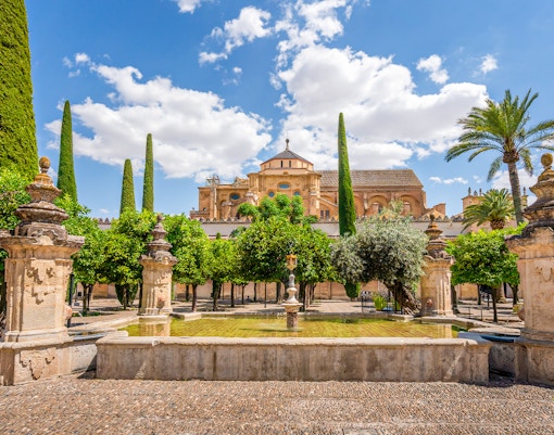 Mezquita Córdoba Orange Tree Courtyard with fountain and historic architecture.