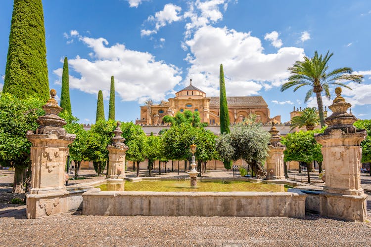 Orange Tree Courtyard at Mezquita Cordoba with historic arches and orange trees.