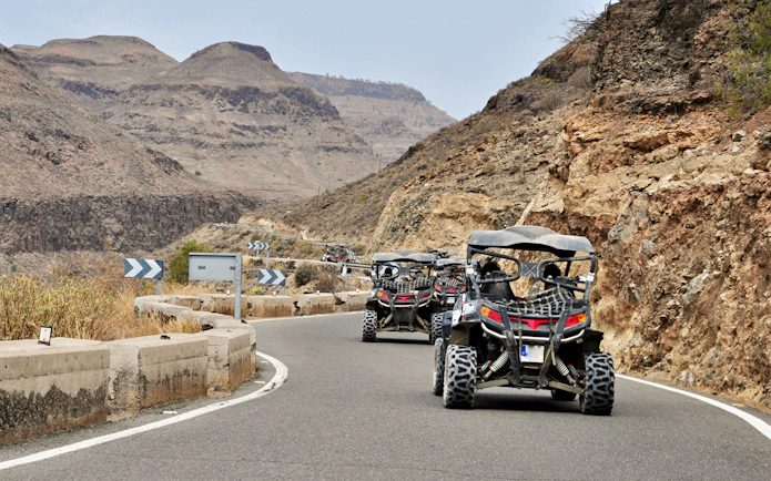 Buggy tour on winding mountain road in Gran Canaria.
