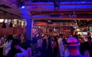 Tirana Pub Crawl: Guided Nightlife Tour with Entry to Three Venues, Welcome Drinks, and DJ Entertainment