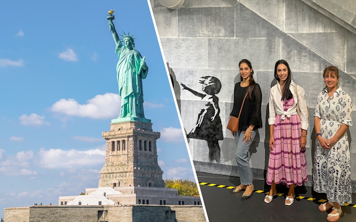 Statue of Liberty and visitors at Banksy Museum exhibit in New York City.