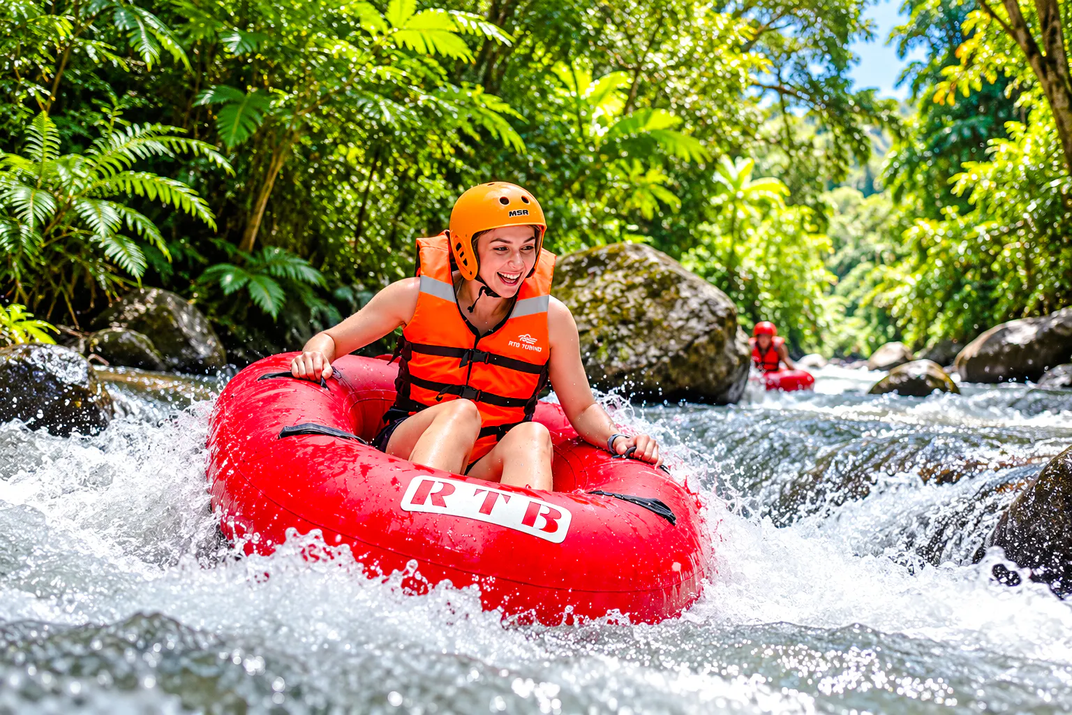 Tubing adventure on Pekerisan River, Bali amidst lush greenery.