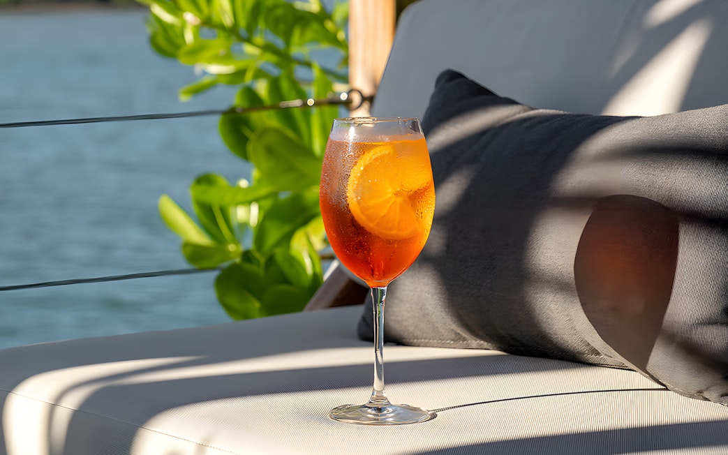 Cocktail on a lounge chair at Yona Beach Club, Phuket.