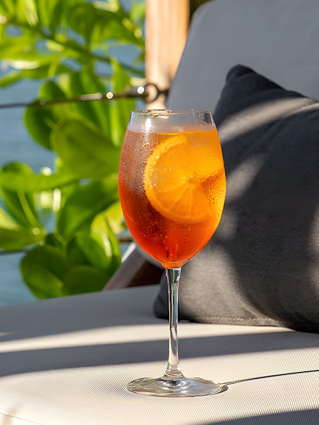 Cocktail on a lounge chair at Yona Beach Club, Phuket.