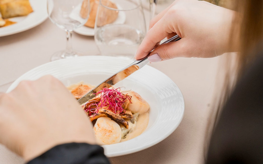 Dining on French cuisine during Seine River cruise in Paris.