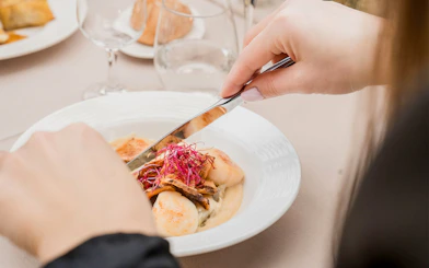 Dining on French cuisine during Seine River cruise in Paris.