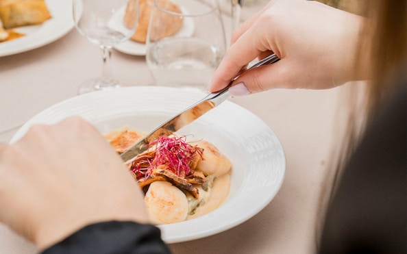 Dining on French cuisine during Seine River cruise in Paris.
