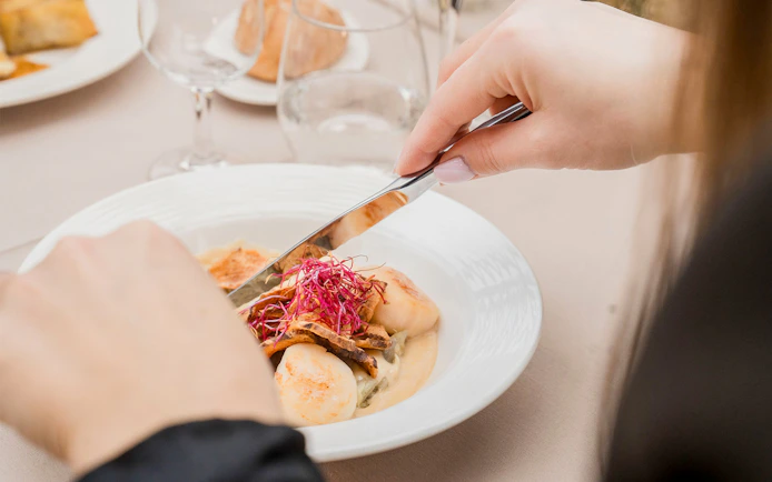 Dining on French cuisine during Seine River cruise in Paris.