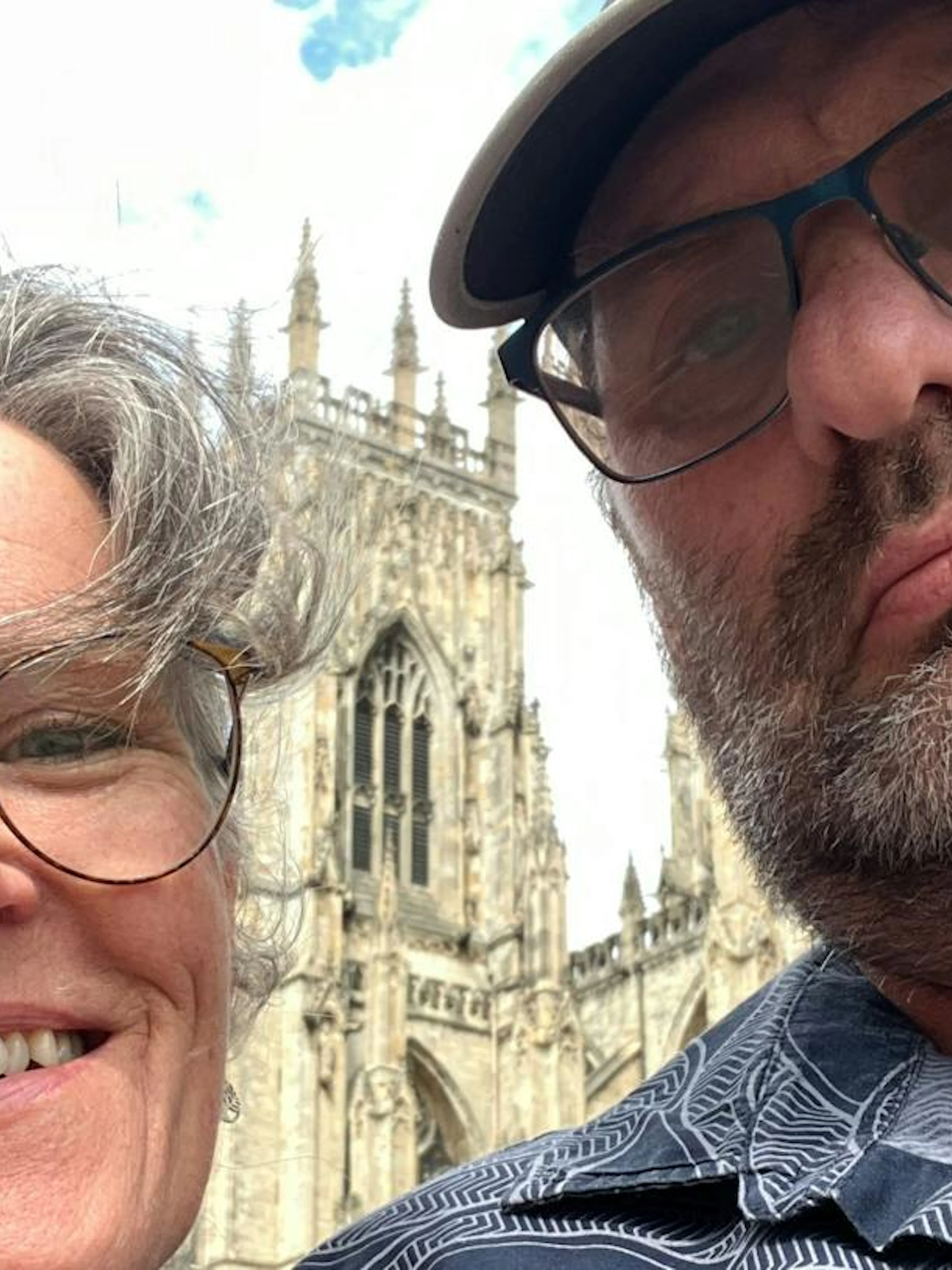 Two people in front of York Minster during a self-guided city exploration game in York.