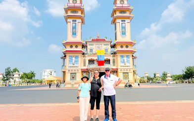 Cao Dai Holy See with visitors in Tay Ninh, near Ho Chi Minh City.