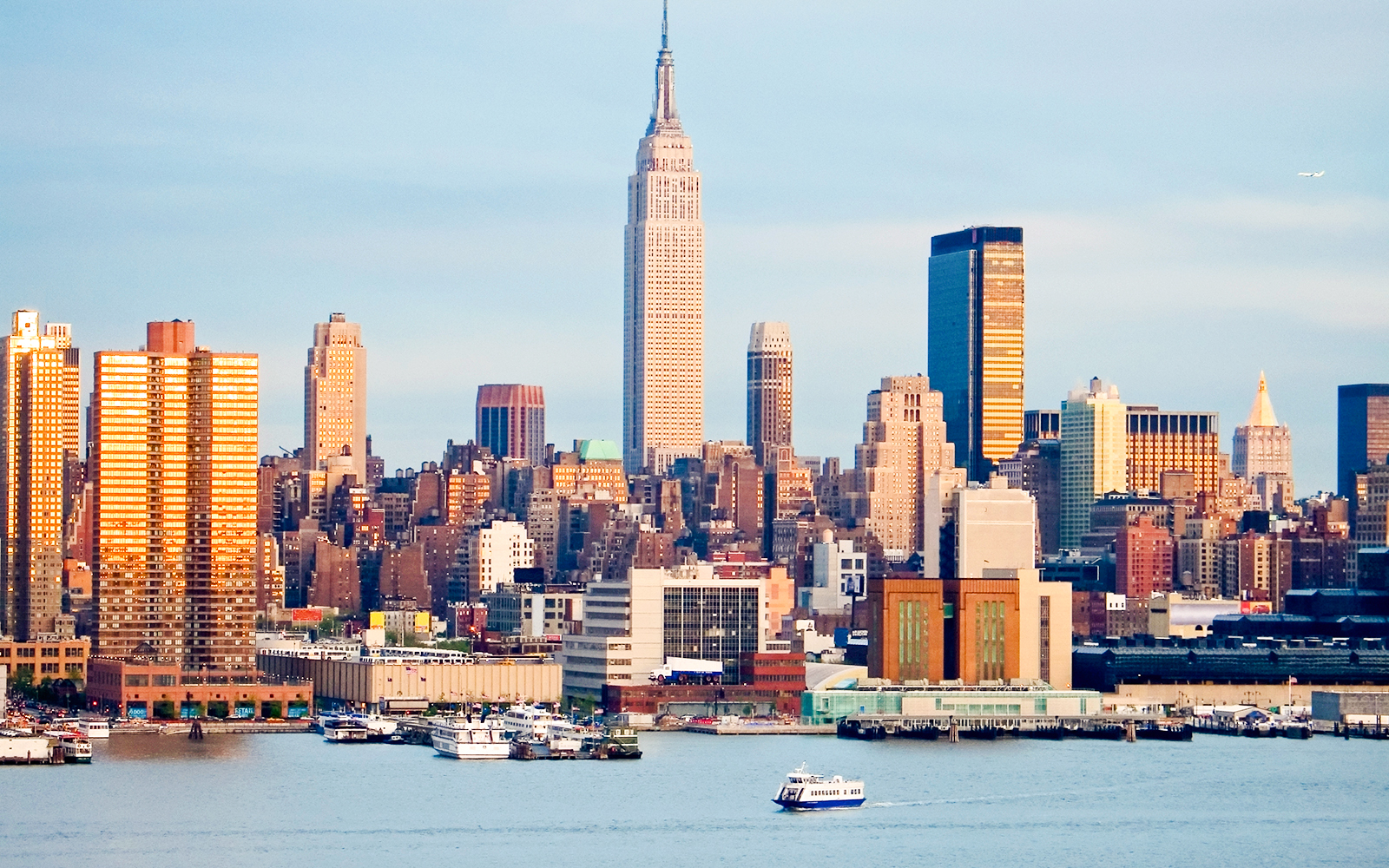 New York skyline with Empire State Building and waterfront view.