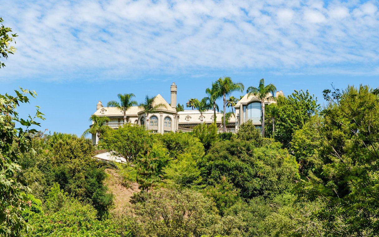 Luxury home surrounded by trees in Hollywood Hills, Los Angeles, California.