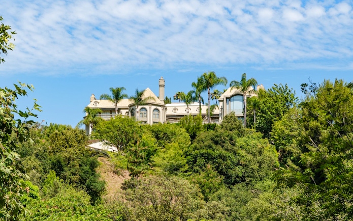 Luxury home surrounded by trees in Hollywood Hills, Los Angeles, California.