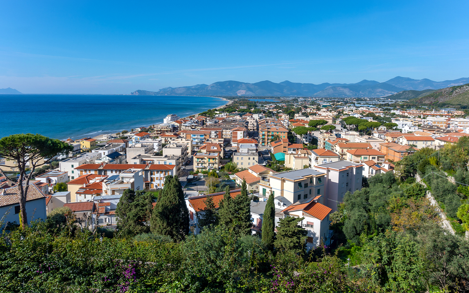 Sperlonga coastal view with historic white buildings and Mediterranean Sea.
