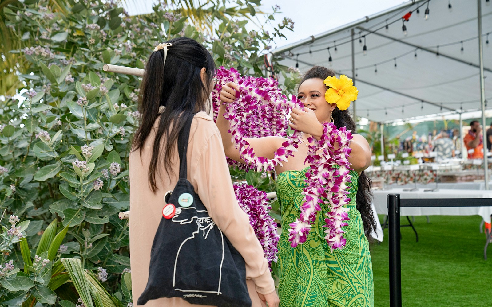 A Lei welcome to the guests by staff at Mauka Warriors Luau, Hawaii