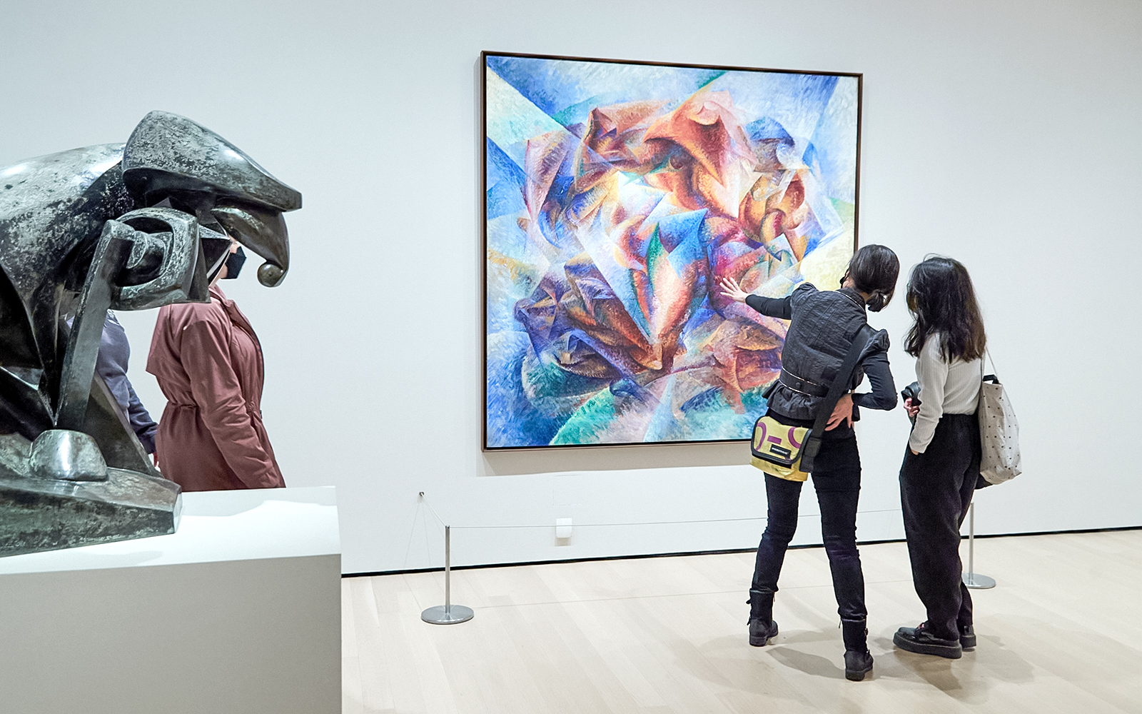 Visitors viewing abstract art and sculpture at The Museum of Modern Art (MoMA).