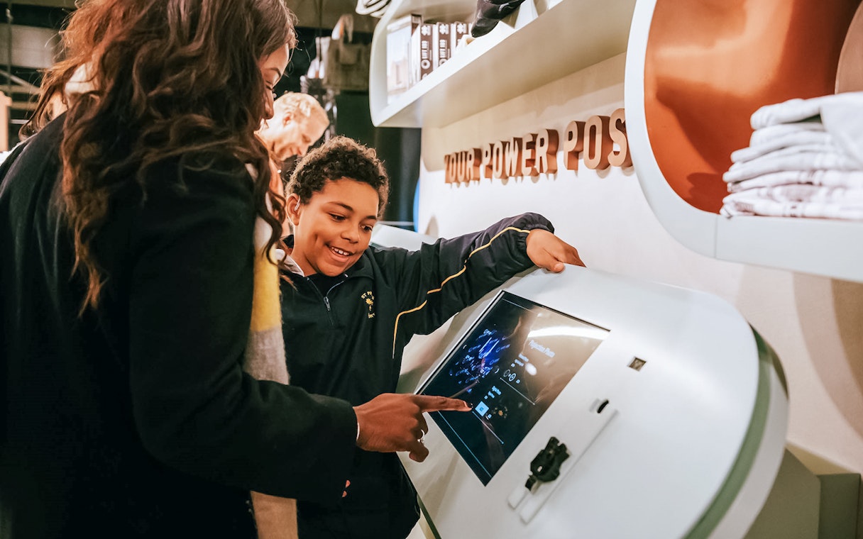 Visitors interacting with a digital display at Battersea Power Station's Lift 109 experience.