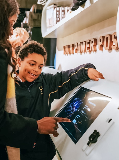 Visitors interacting with a digital display at Battersea Power Station's Lift 109 experience.