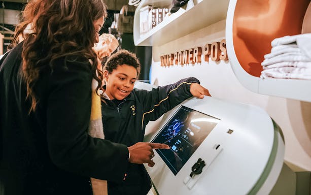 Visitors interacting with a digital display at Battersea Power Station's Lift 109 experience.