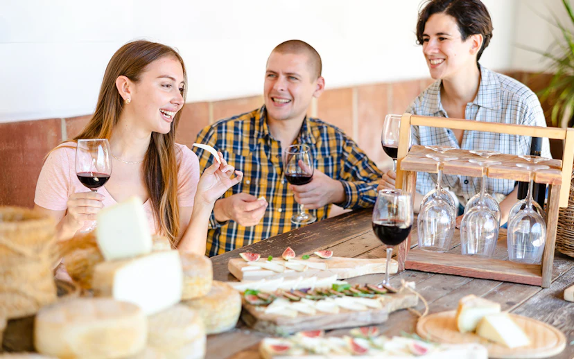 Guests enjoying wine and cheese at Cheese Museum in Paris.