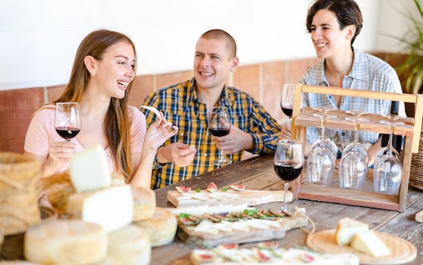 Guests enjoying wine and cheese at Cheese Museum in Paris.