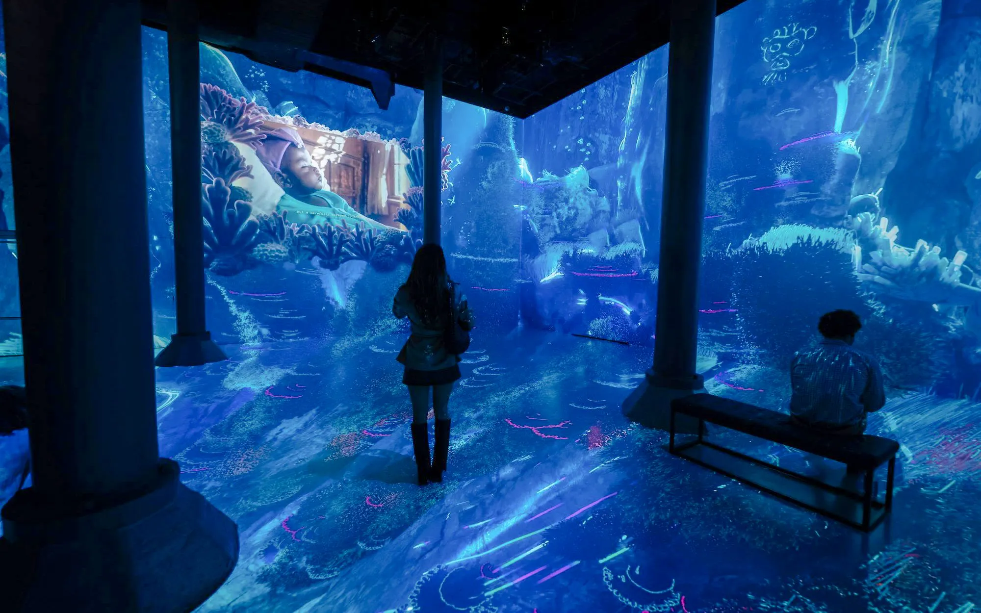 Guests viewing immersive digital art at ARTECHOUSE DC exhibit.