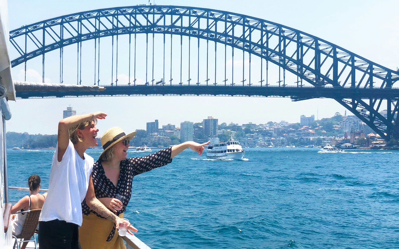 Sydney Harbour Sightseeing Cruise with view of Sydney Opera House and Harbour Bridge.