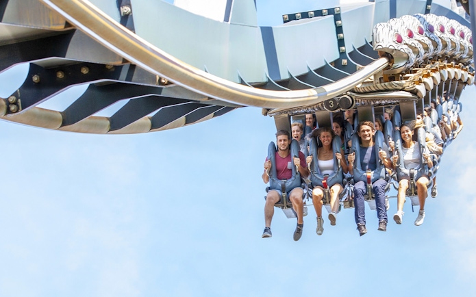 Visitors enjoying a roller coaster ride at Mirabilandia Park, Italy.