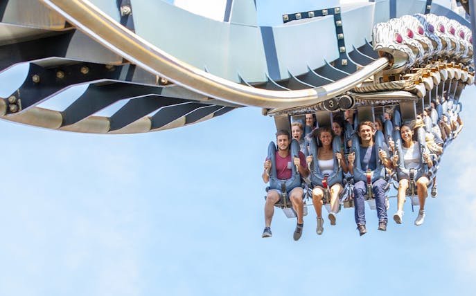Visitors enjoying a roller coaster ride at Mirabilandia Park, Italy.