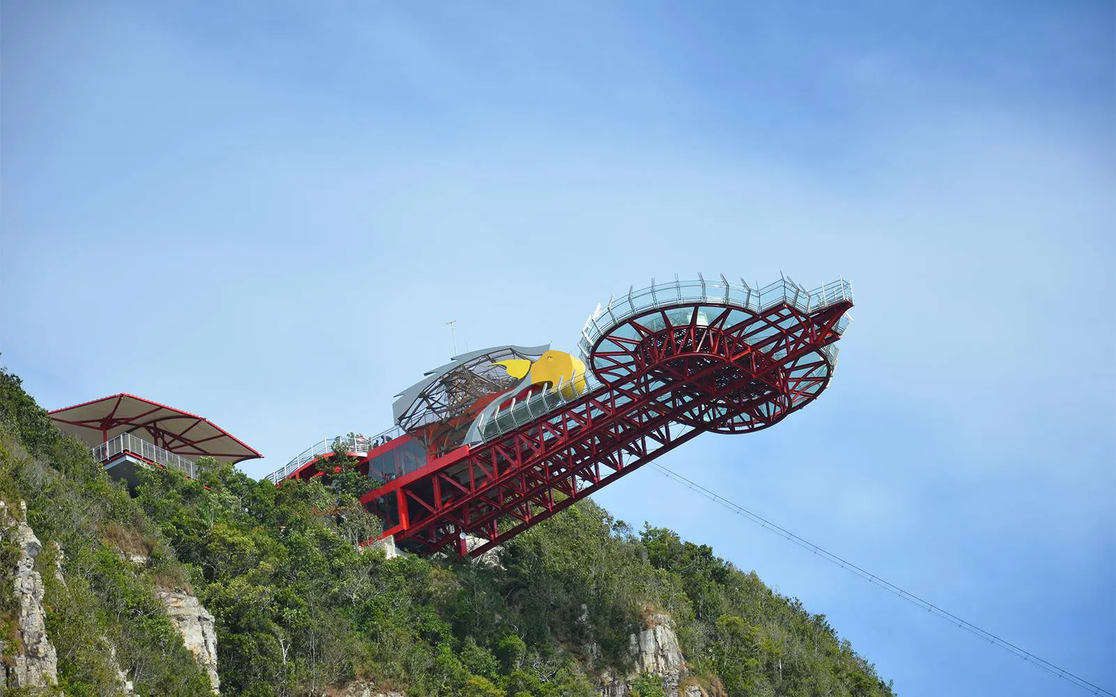 Langkawi Cable Car station with Skywalk and SkyBridge structure against blue sky.
