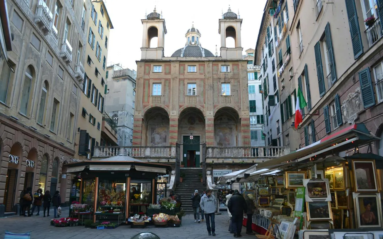 Historic building and market stalls in Genoa city center, part of the self-guided exploration game.