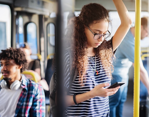 AEROBÚS shuttle at Barcelona airport terminal for city transfer.