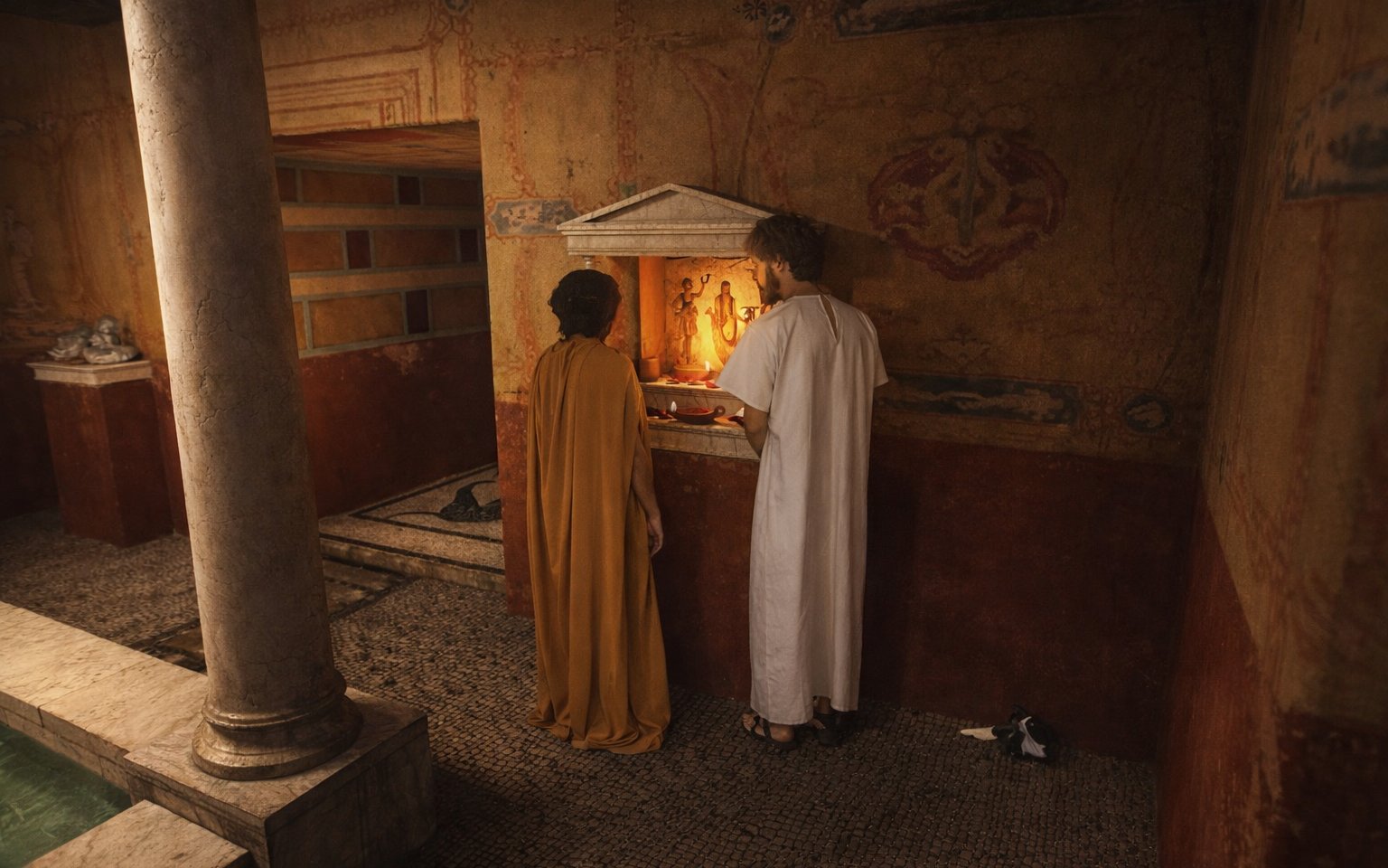 Two people in historical attire at an ancient altar, Setas de Sevilla tour.
