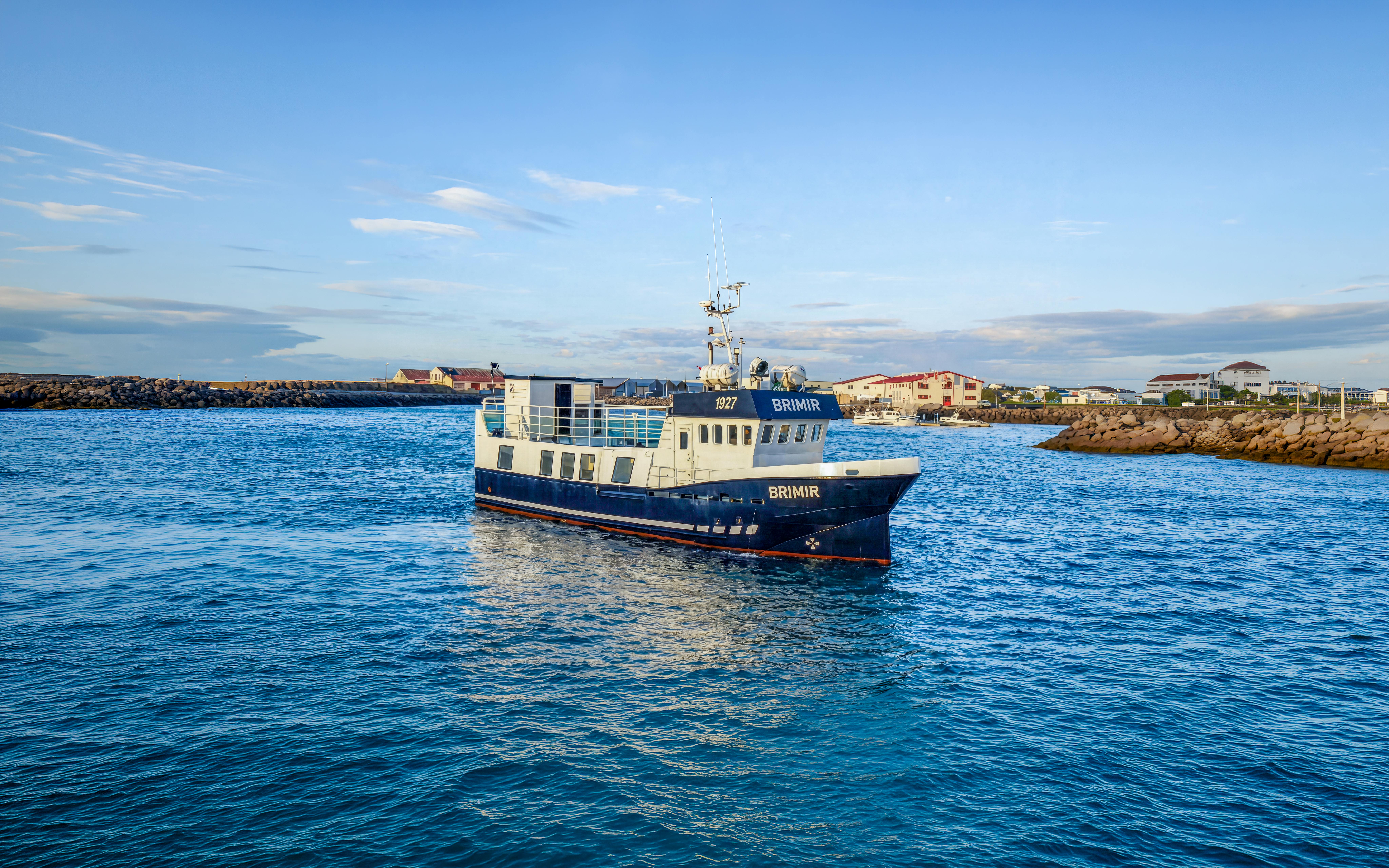 Whale watching boat in Akureyri harbor, Iceland, ready for a cruise-friendly tour.