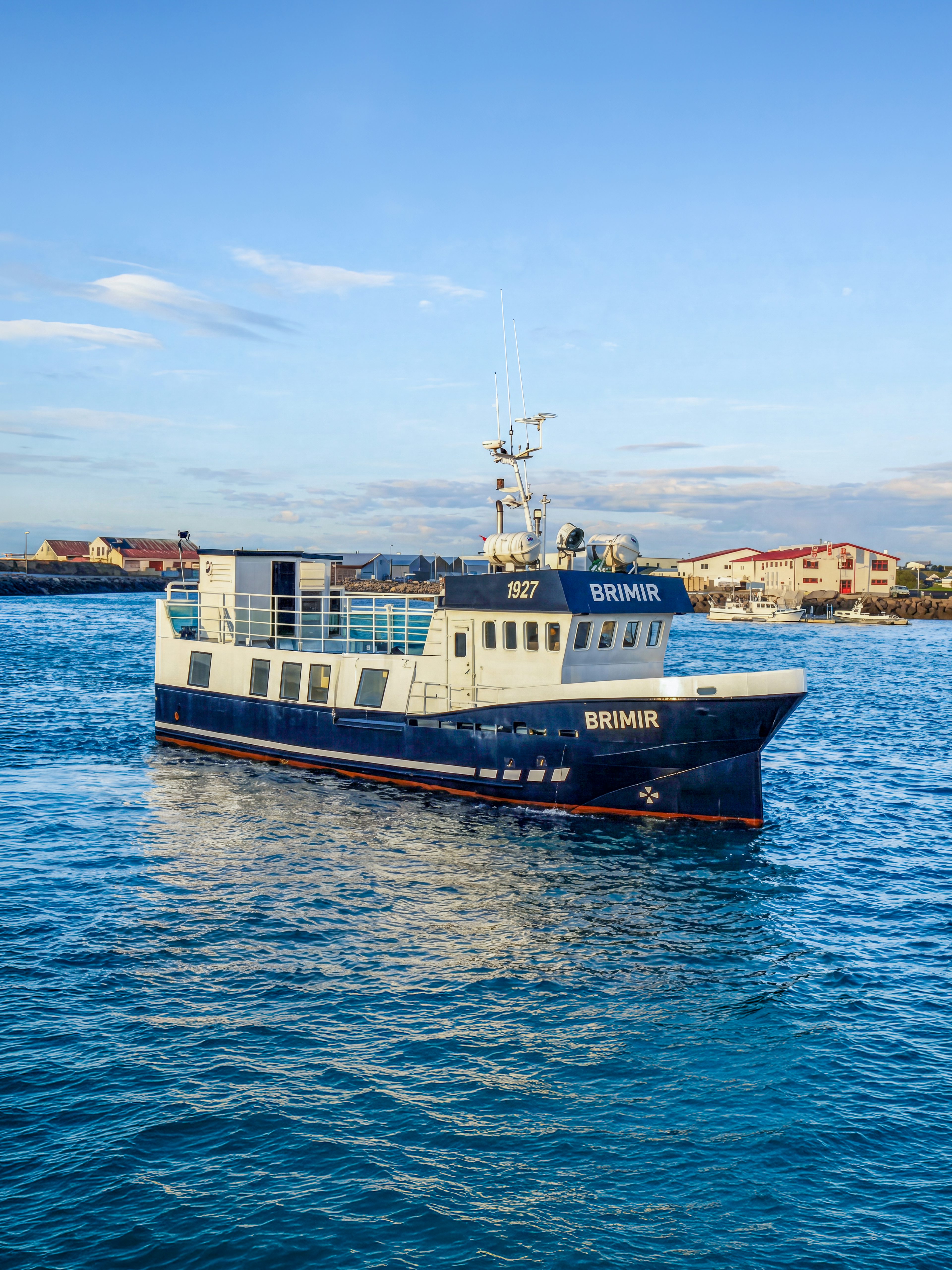 Whale watching boat in Akureyri harbor, Iceland, ready for a cruise-friendly tour.