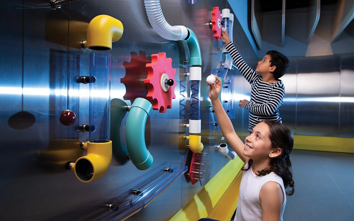 Children interacting with hands-on exhibits at SparkLab, Queensland Museum Kurilpa.