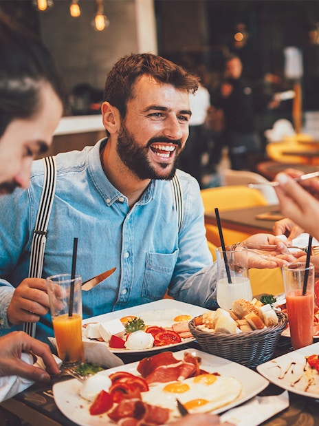 Dining experience at Flora Danica Paris on the Champs Elysées with friends enjoying aperitifs.