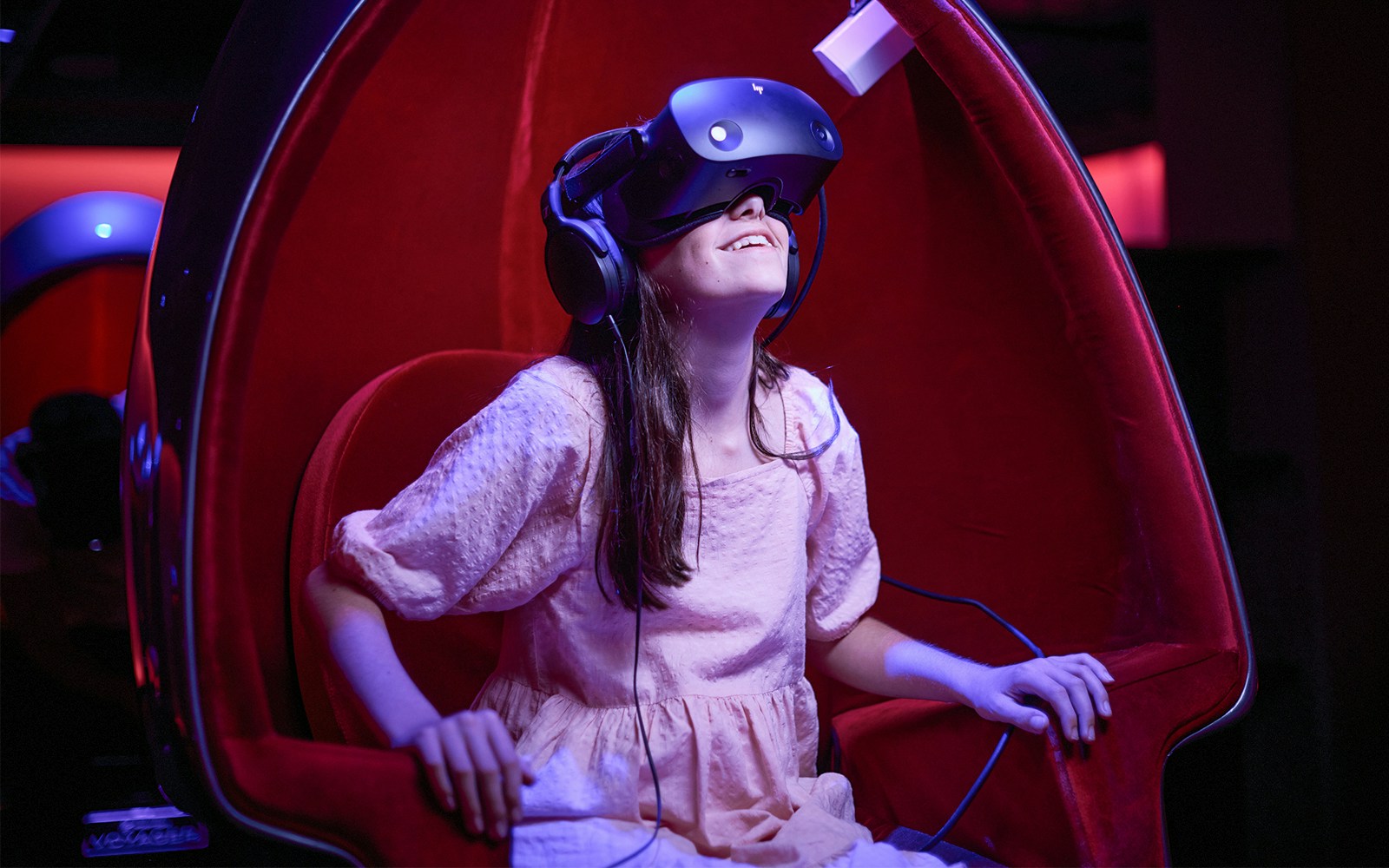 Visitor experiencing virtual reality at Blue Planet Aquarium.