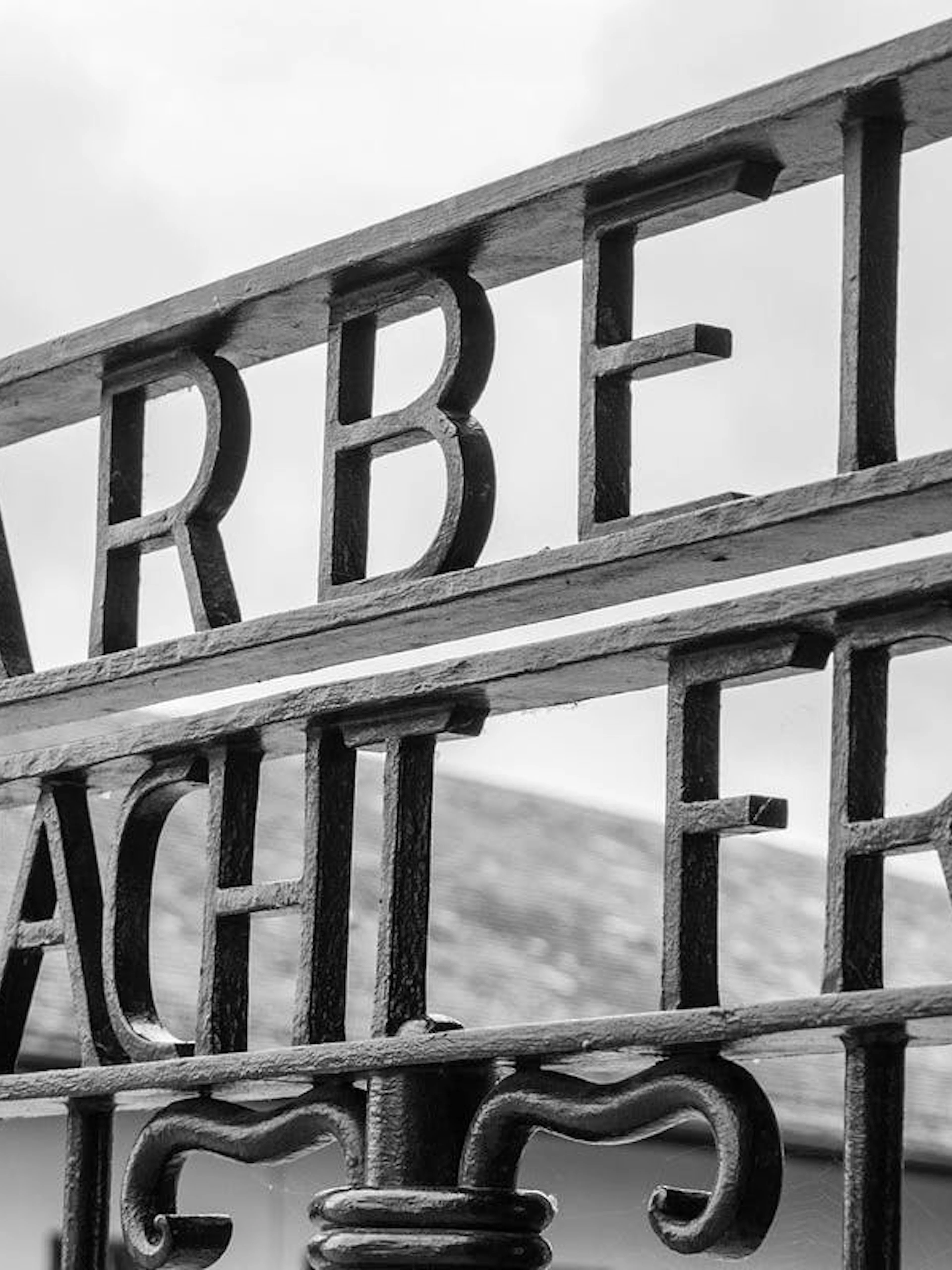 Entrance gate with "Arbeit Macht Frei" at Dachau Memorial Site, Germany.
