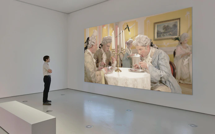 Visitor viewing Ragnar Kjartansson's "Mercy" exhibition at National Gallery of Victoria.