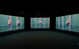Multiscreen display of Ragnar Kjartansson's Mercy exhibition at National Gallery of Victoria.