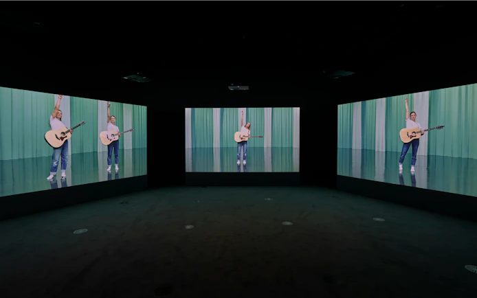 Multiscreen display of Ragnar Kjartansson's Mercy exhibition at National Gallery of Victoria.