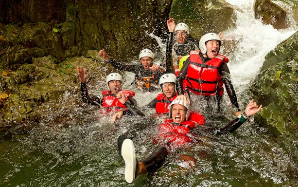 Group enjoying water canyoning adventure in Braga.