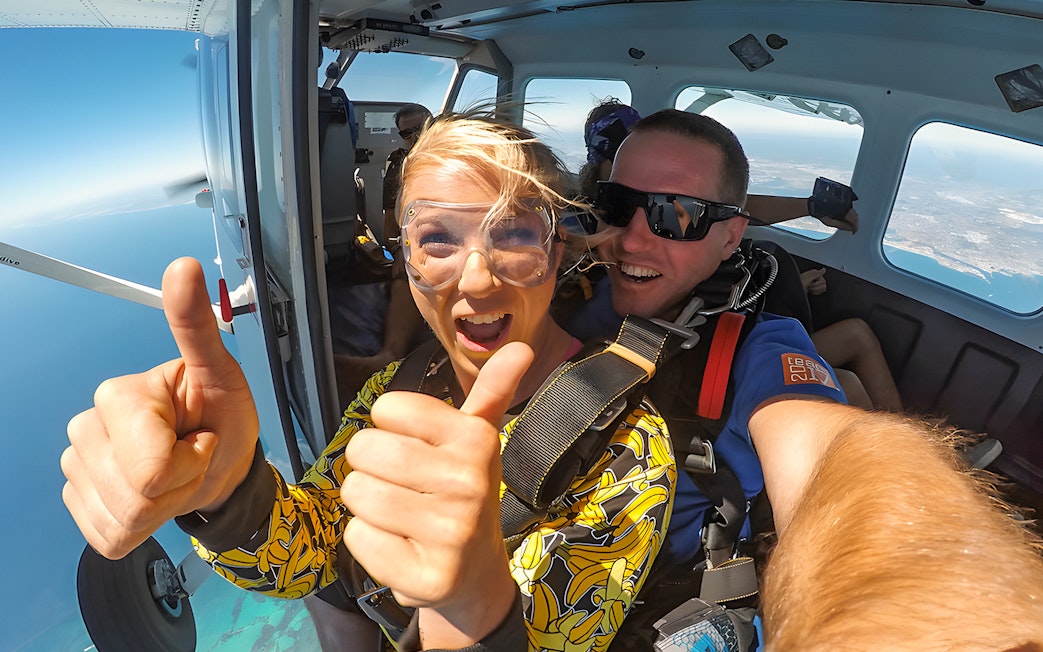 Skydivers preparing to jump from plane over Rottnest Island.