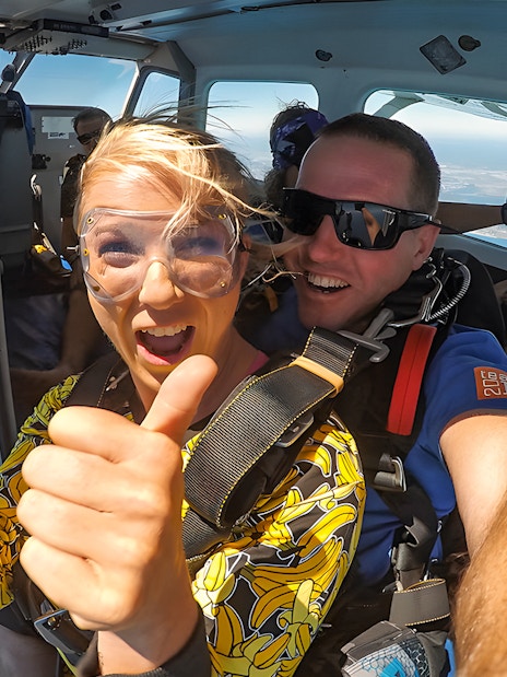Skydivers preparing to jump from plane over Rottnest Island.