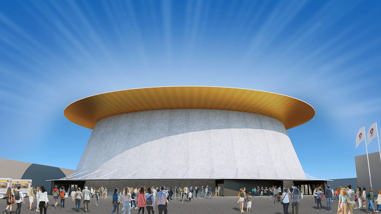 Crowd outside a pavilion at Expo 2025 Osaka with flags and blue sky.